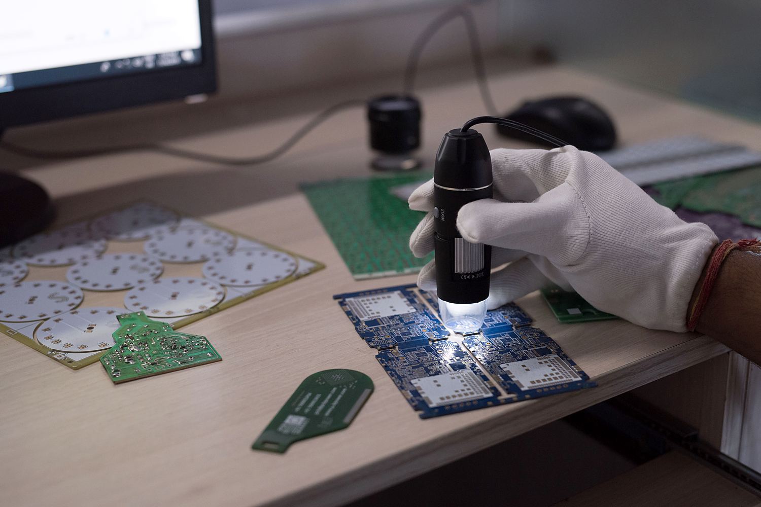 Inspection under a digital microscope, Sara Circuits plant, Barwala